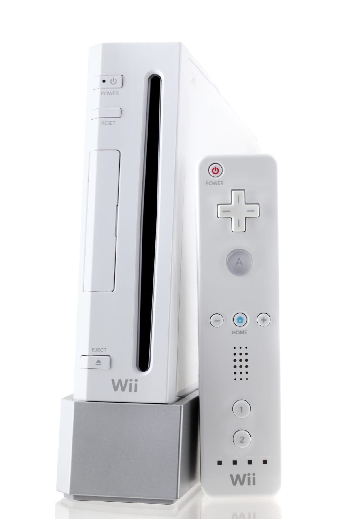 Providence, RI, USA - March 13, 2011: A white Nintendo Wii console and WiiMote controller made by Nintendo isolated on a white background on a reflective surface