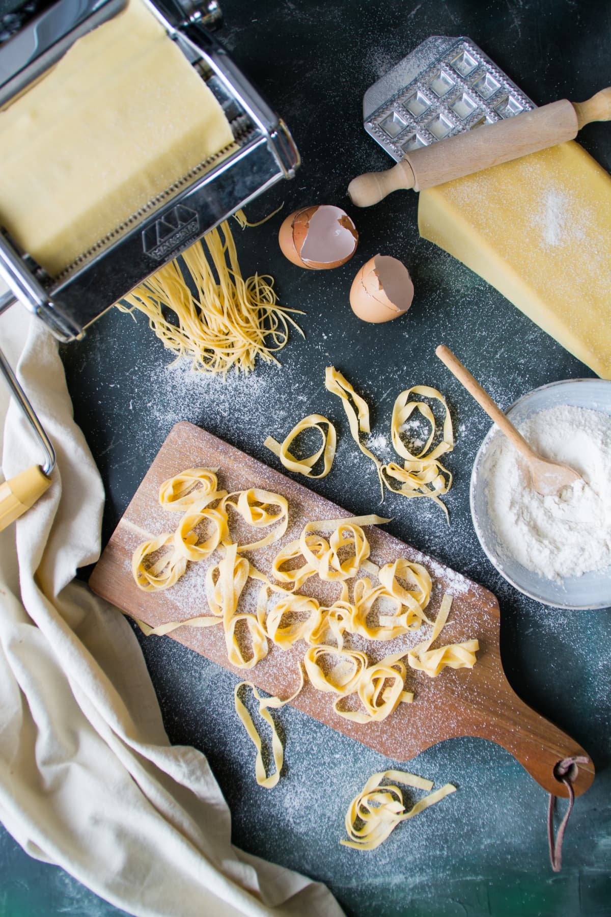 Various ingredients and tools for making pasta on a counter