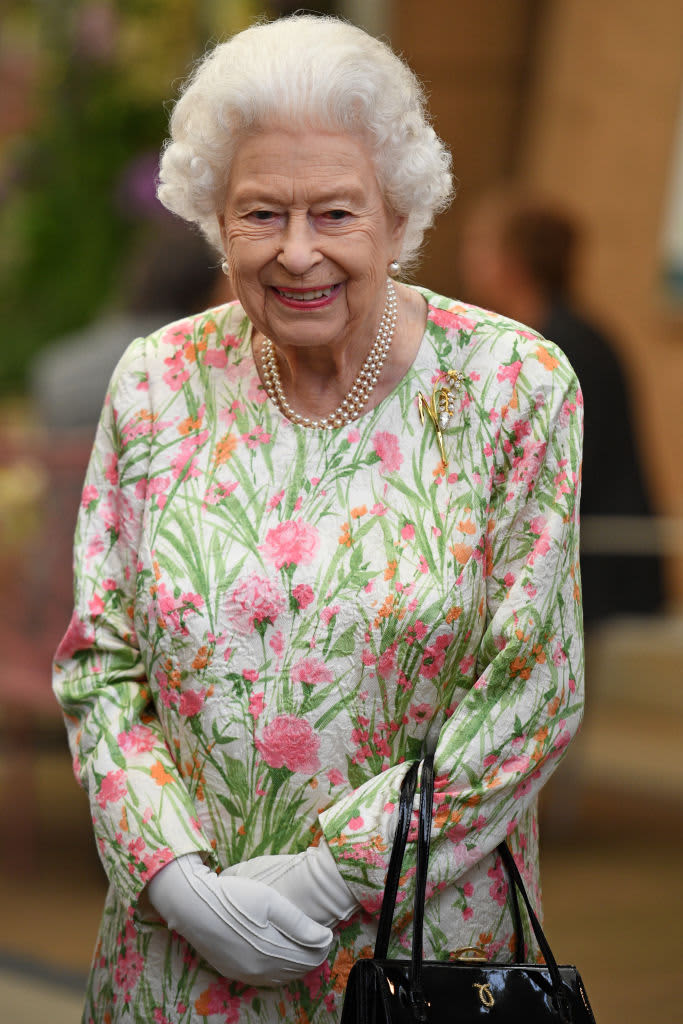 ST AUSTELL, ENGLAND - JUNE 11: Queen Elizabeth II smiles as she meets people from communities across Cornwall during an event in celebration of The Big Lunch initiative at The Eden Project during the G7 Summit on June 11, 2021 in St Austell, Cornwall, England. UK Prime Minister, Boris Johnson, hosts leaders from the USA, Japan, Germany, France, Italy and Canada at the G7 Summit. This year the UK has invited India, South Africa, and South Korea to attend the Leaders' Summit as guest countries as well as the EU. (Photo by Oli Scarff - WPA Pool / Getty Images)
