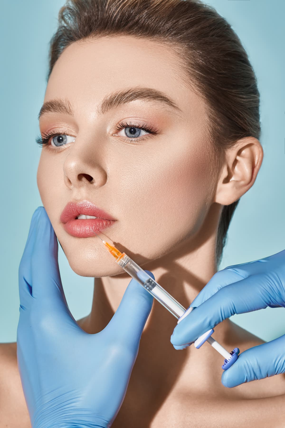 Woman getting cosmetic injection of botox near lips, closeup. Woman in beauty salon. plastic surgery clinic.