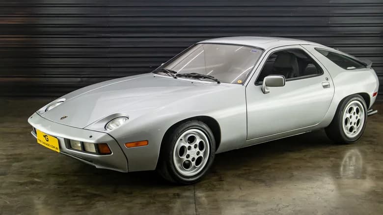 John Newell of John Newell Porsche in Flinders st Surry Hills, with a Porsche 928 S4, similar to a 928 S4 he recently sold for $135,000. The normal price for such a car is $230,000. John Newell has finally decided to get out of selling Porsches, BMW's, and Honda's and will now sell Mazada's. September 12, 1991. (Photo by David porter/Fairfax Media via Getty Images).