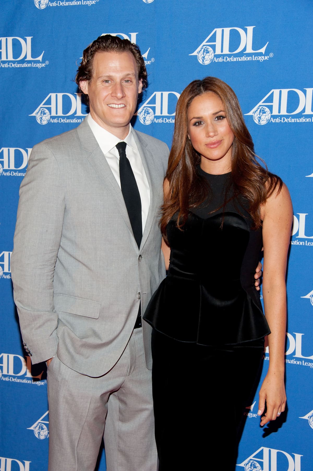 BEVERLY HILLS, CA - OCTOBER 11:  Trevor Engelson (L) and wife actress Meghan Markle arrives at the Anti-Defamation League Entertainment Industry Awards Dinner Honoring Ryan Kavanaugh at The Beverly Hilton hotel on October 11, 2011 in Beverly Hills, California.  (Photo by Michael Kovac/WireImage)