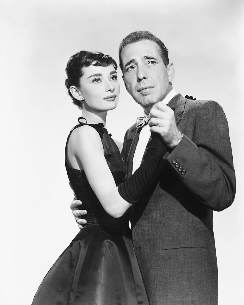 Actors Audrey Hepburn and Humphrey Bogart in a publicity still for the romantic comedy 'Sabrina', 1954.   (Photo by Silver Screen Collection/Getty Images)