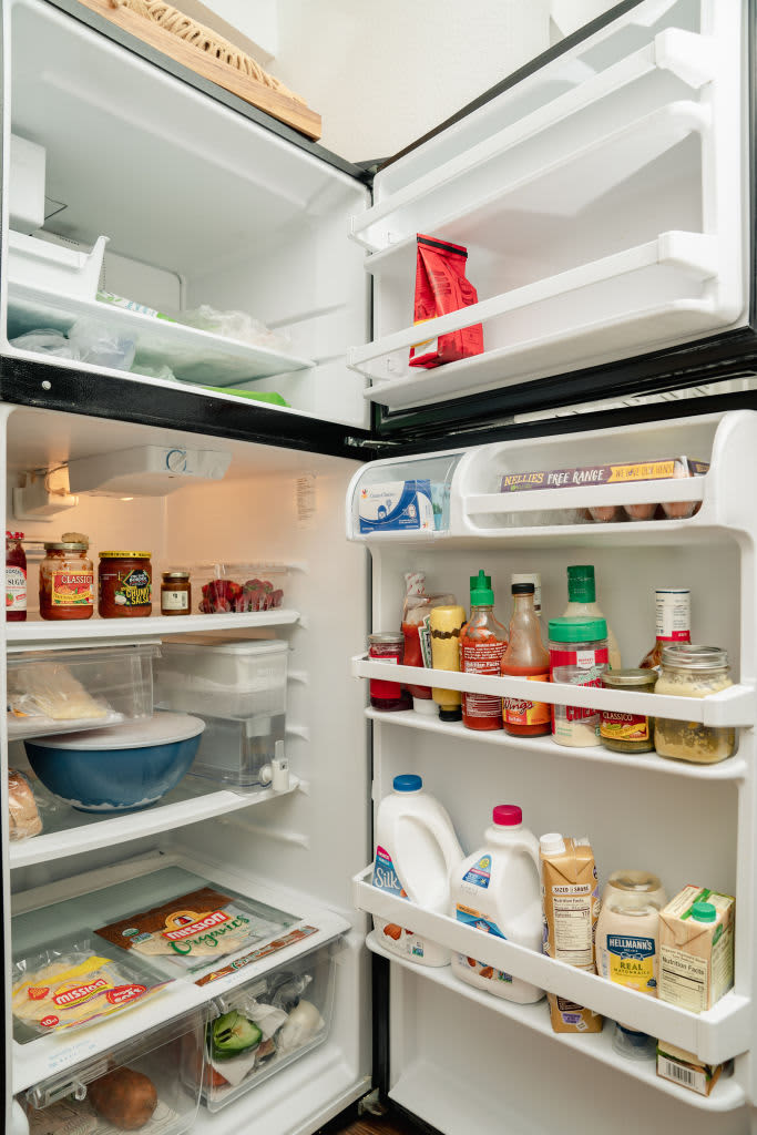 An open refrigerator with various food items