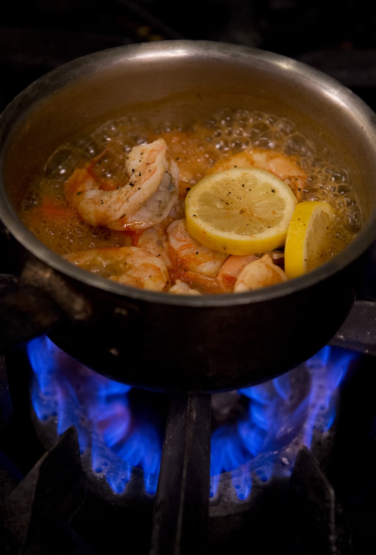 UNITED STATES - JUNE 13: Shrimp and lemons boil on a stove in the kitchen of Farmers Fishers Bakers restaurant on the Georgetown waterfront. (Photo By Tom Williams/CQ Roll Call)