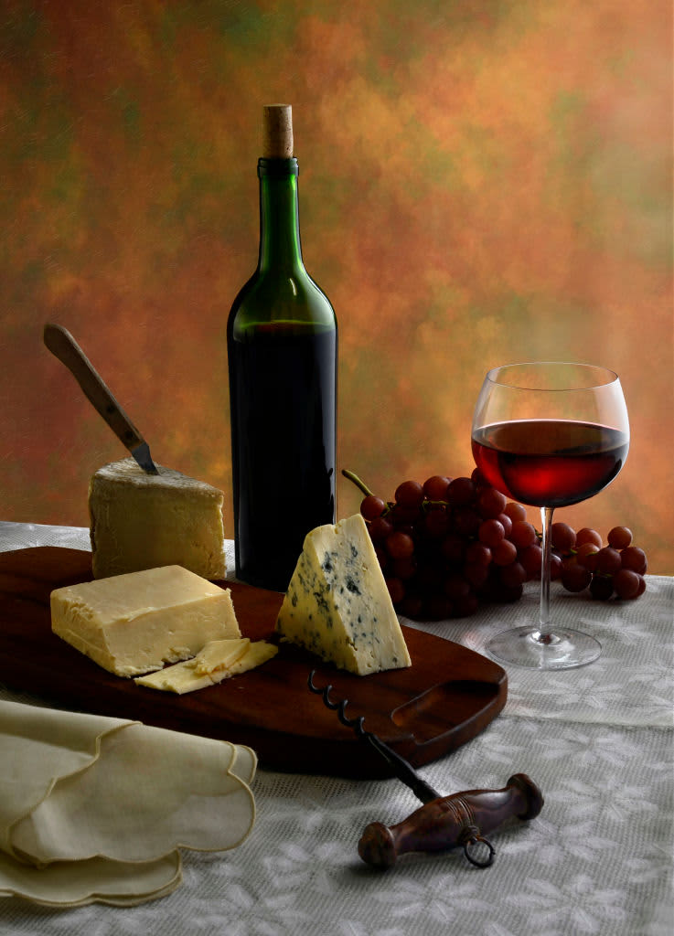 Still life of a wine bottle, wine glass, and cheeses, with a corkscrew, 2012. (Photo by Tom Kelley/Getty Images)