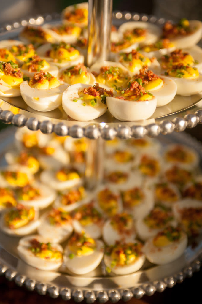 Deviled eggs on a serving tray.