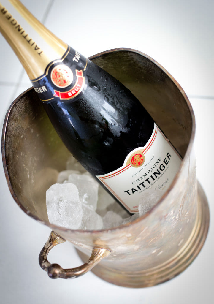 (GERMANY OUT)   A bottle of Champagne made by Taittinger, next to a silver champagne bucket.   (Photo by Dünzl\ullstein bild via Getty Images)