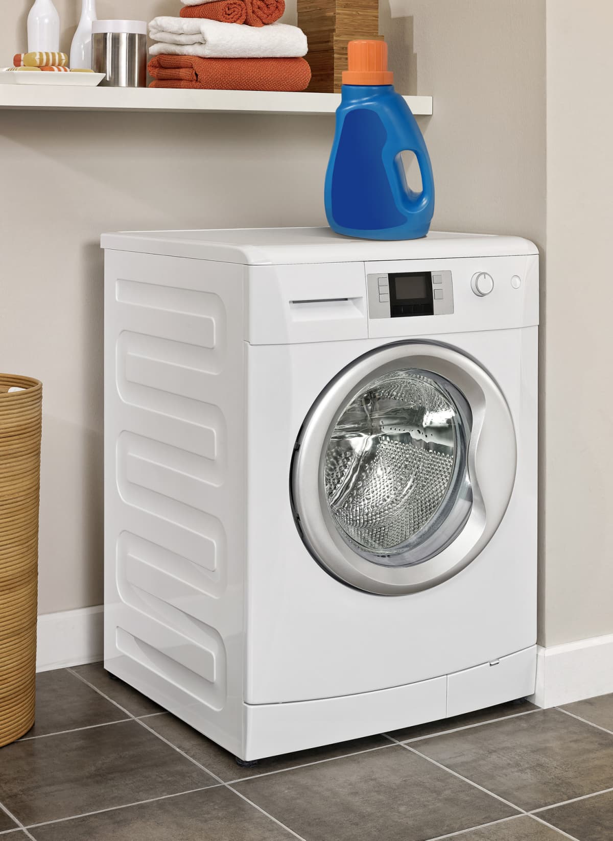 Laundry room with washing machine and laundry detergent
