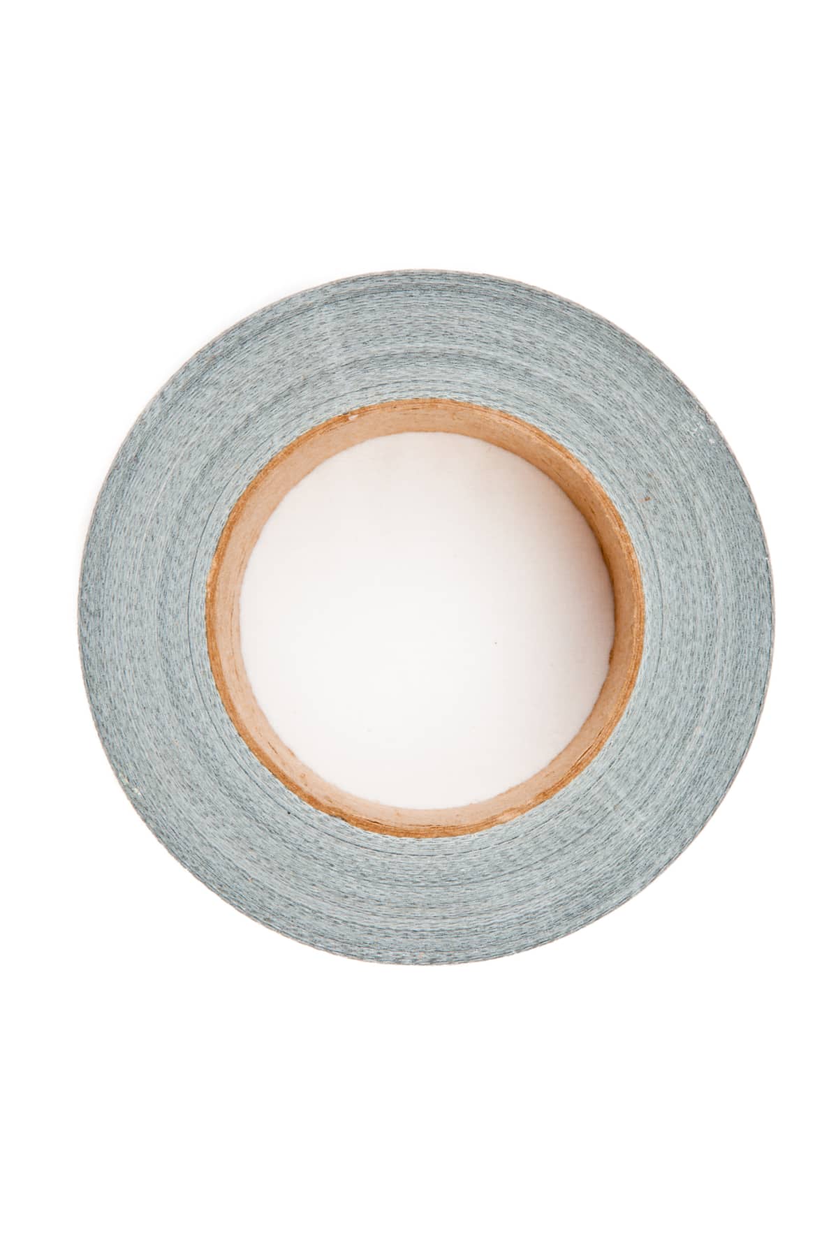 Silver adhesive tape lying on a a white background