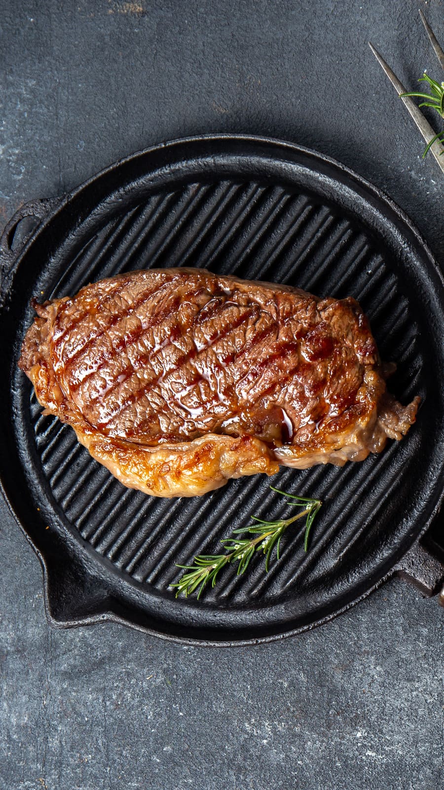 Steak on ridged cast iron skillet