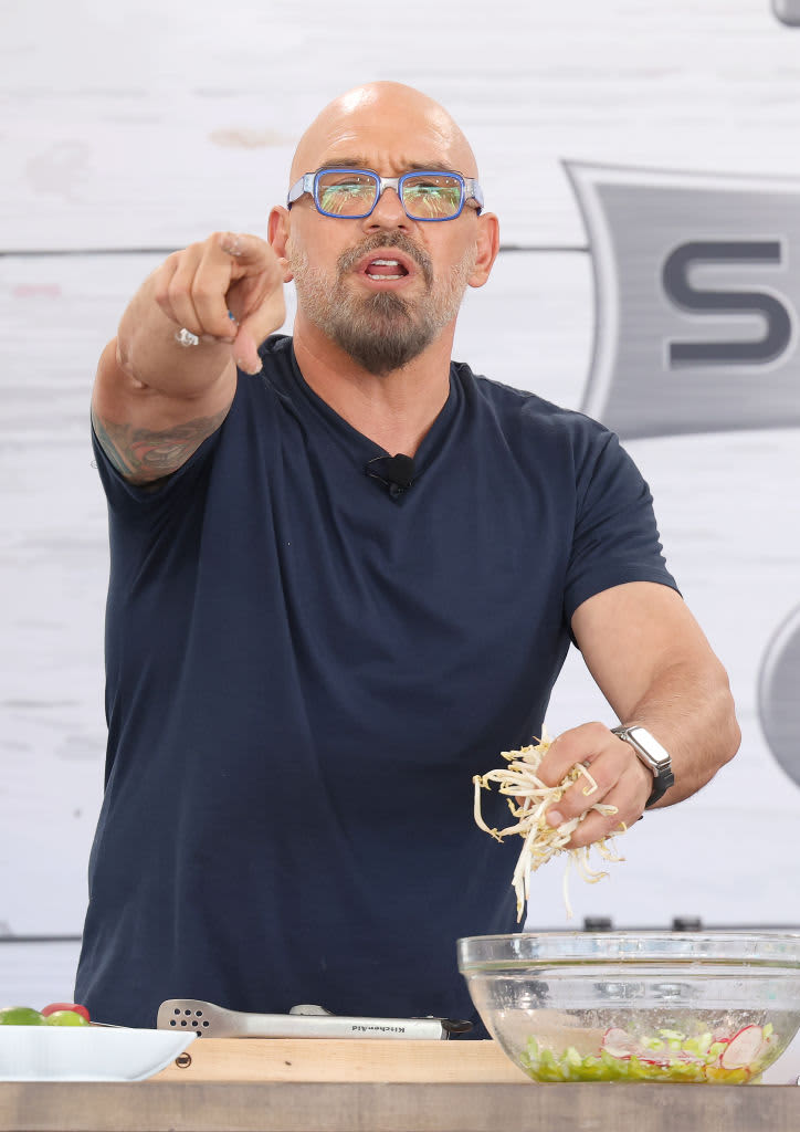 MIAMI BEACH, FL - FEBRUARY 26:  Chef Michael Symon is seen during his demonstration during the South Beach Wine and Food Festival on February 26, 2022 in Miami Beach, Florida.  (Photo by Alexander Tamargo/Getty Images)