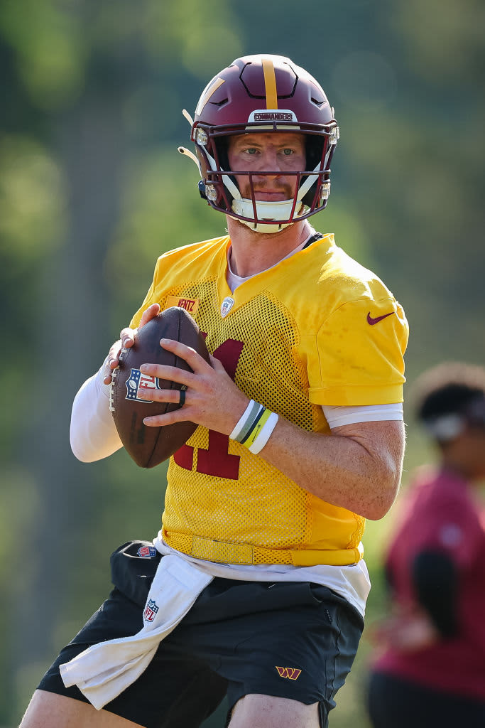 ASHBURN, VA - JUNE 16: Carson Wentz #11 of the Washington Commanders attempts a pass during the organized team activity at INOVA Sports Performance Center on June 16, 2022 in Ashburn, Virginia. (Photo by Scott Taetsch/Getty Images)