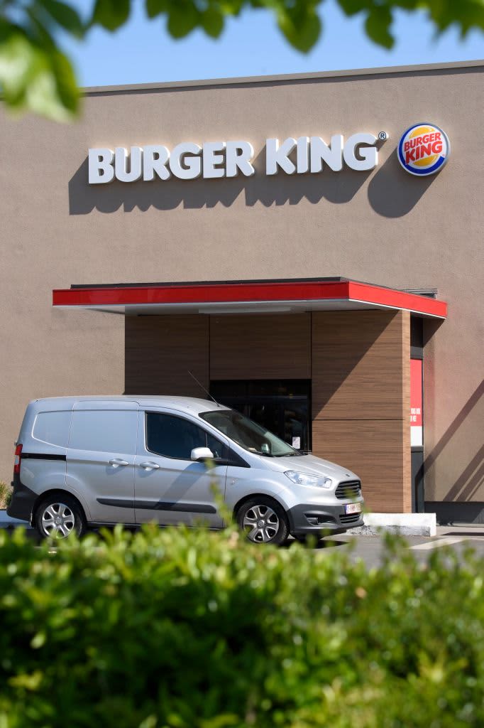 A white van in a Burger King drive-thru