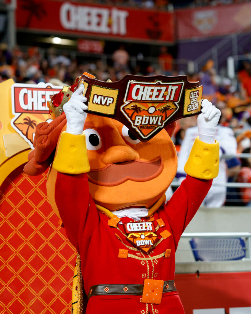 ORLANDO, FLORIDA - DECEMBER 29: General view of the Cheez-It mascot posing with the MVP belt during the fourth quarter of the game between the Clemson Tigers and the Iowa State Cyclones in the Cheez-It Bowl Game at Camping World Stadium on December 29, 2021 in Orlando, Florida. (Photo by Douglas P. DeFelice/Getty Images)