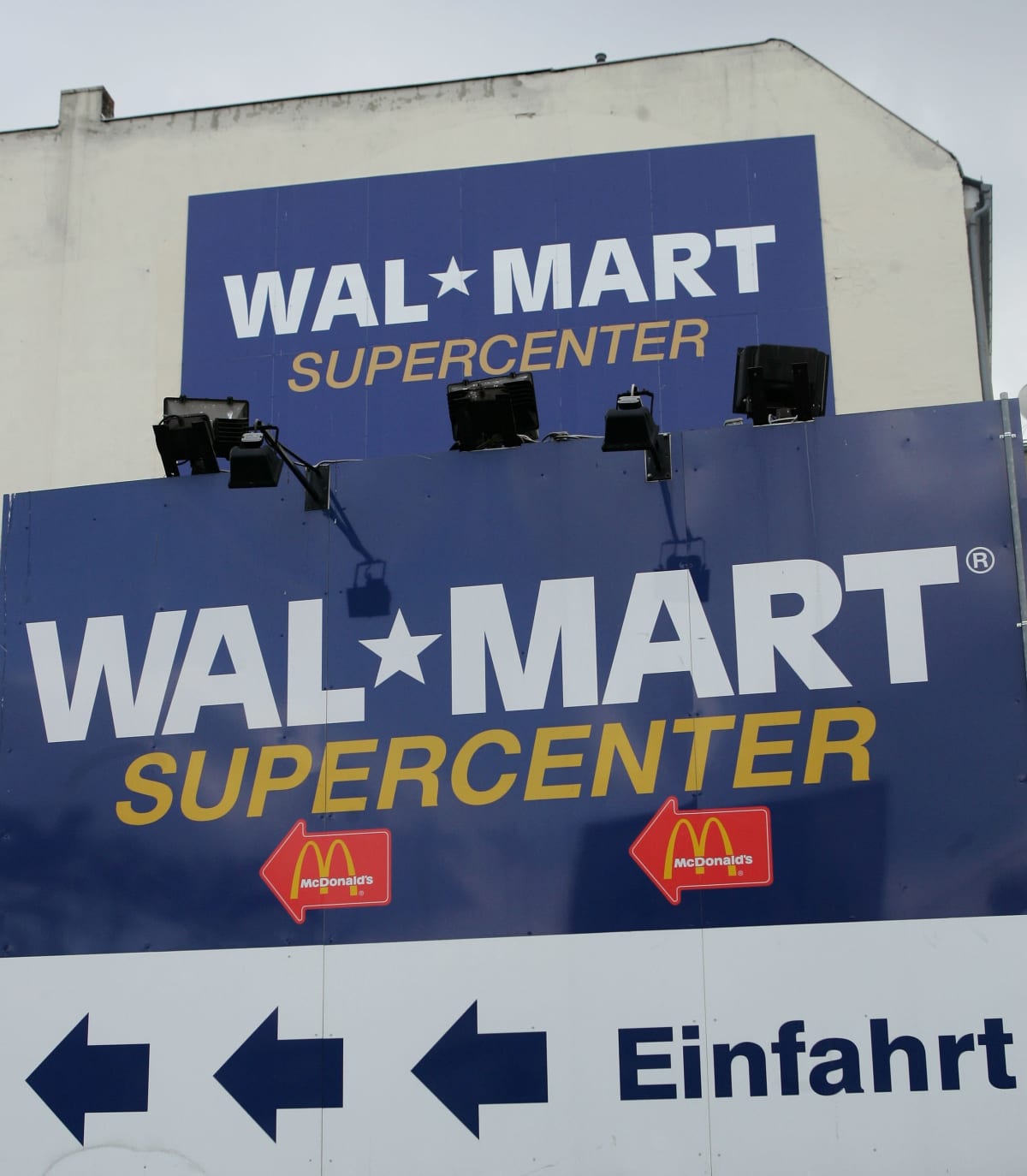 BERLIN - MARCH 2:  Signs advertise the entrance to a Wal-Mart store March 2, 2006 in Berlin, Germany. According to March 2 news reports Wal-Mart suffered losses totaling in the lower hundreds of millions of Euros for its German operations in 2005.    (Photo by Sean Gallup/Getty Images)