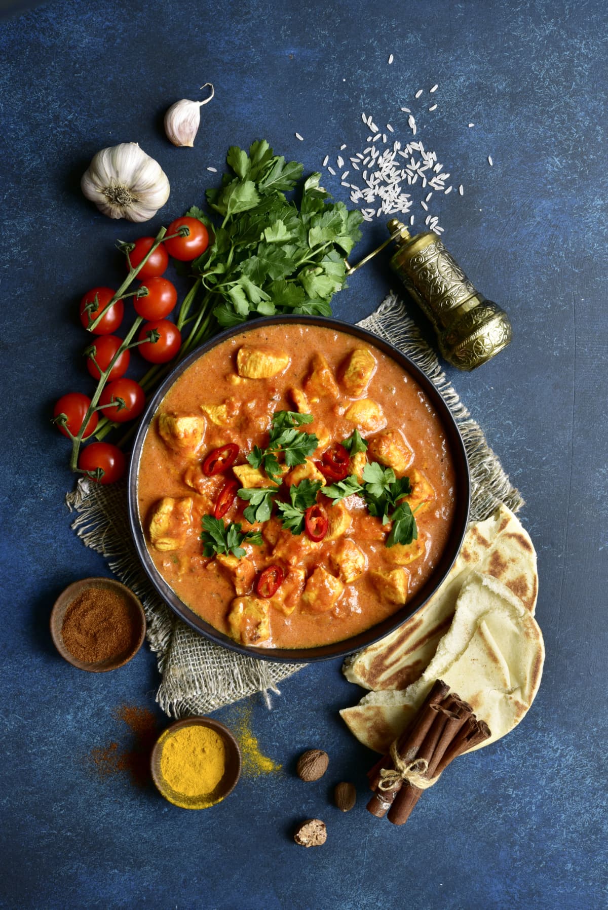 Chicken tikka masala with ingredients and spices