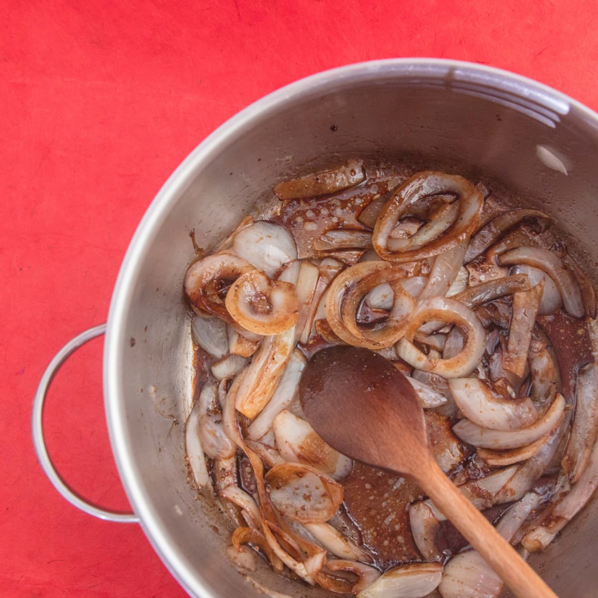 Onions being caramelized in a pan