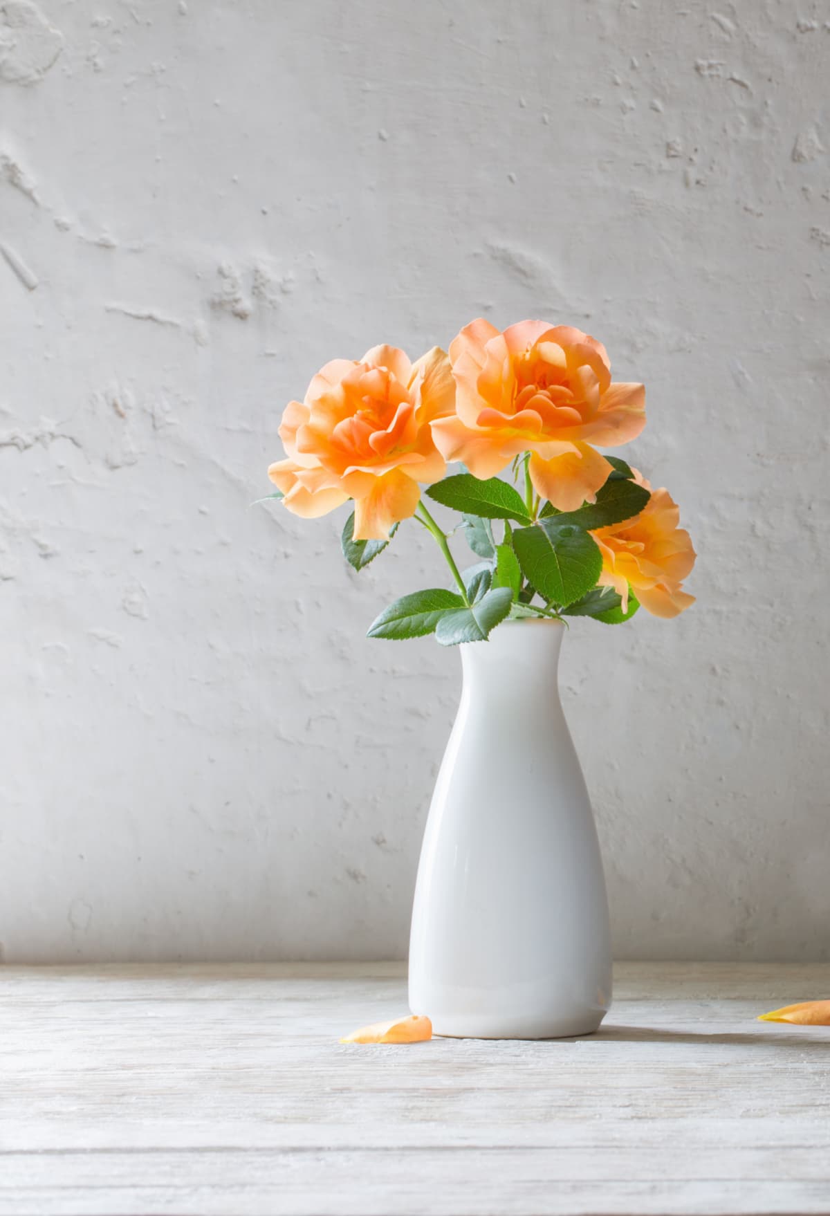Faux orange flowers in a vase