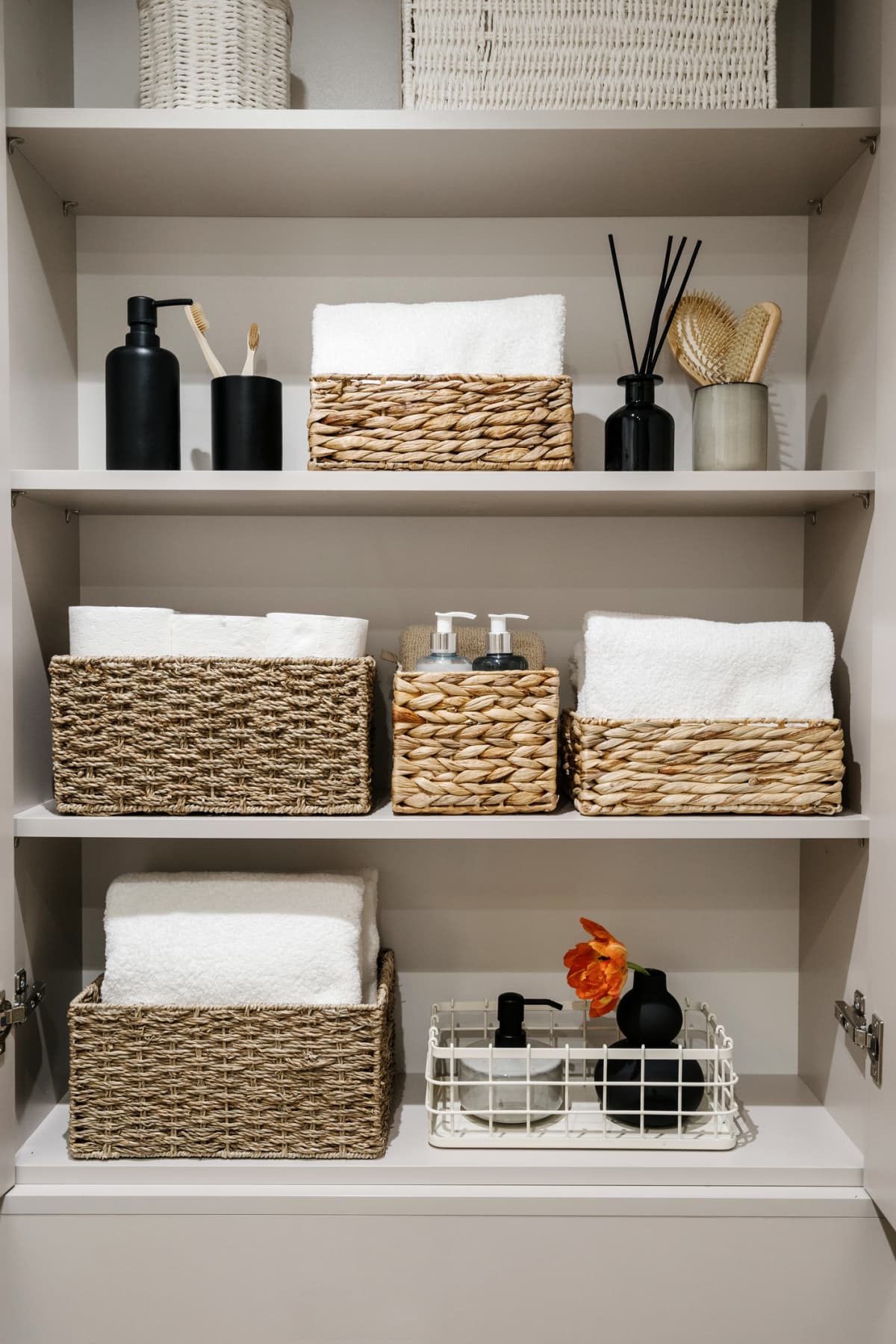 Shelves with baskets in bathroom