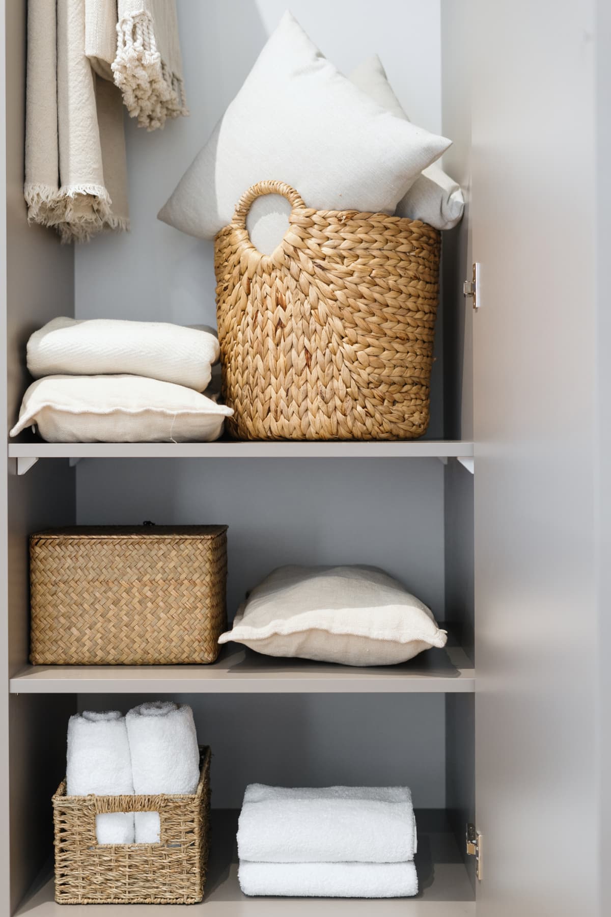 Bathroom accessories being stored on a shelves