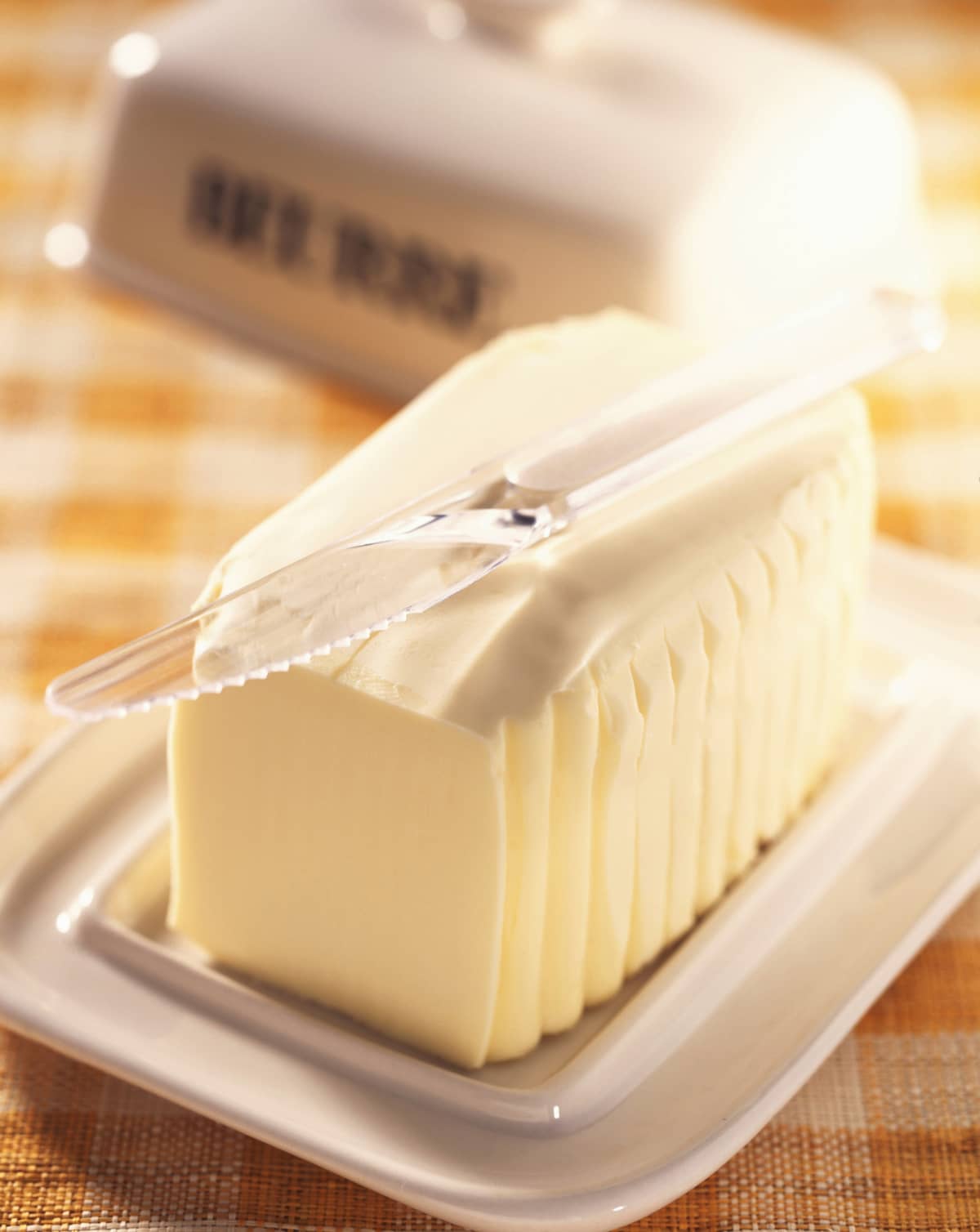 Knife on top of butter in butter dish