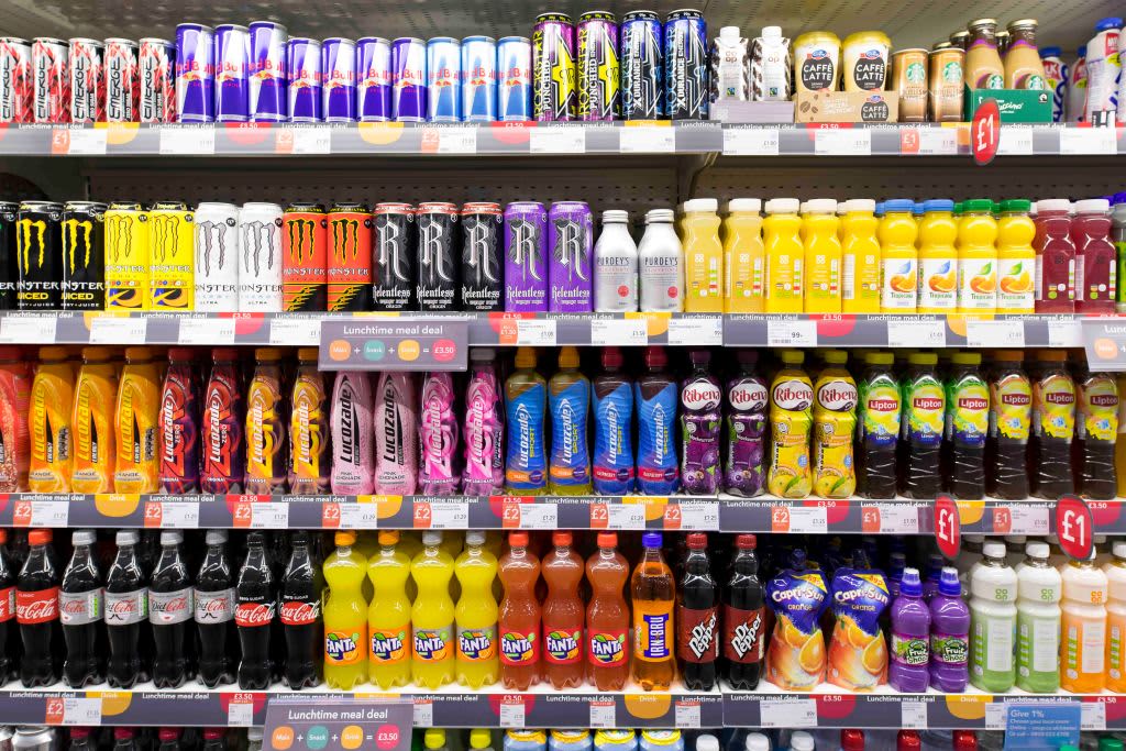 Various brands of energy drinks on store shelves