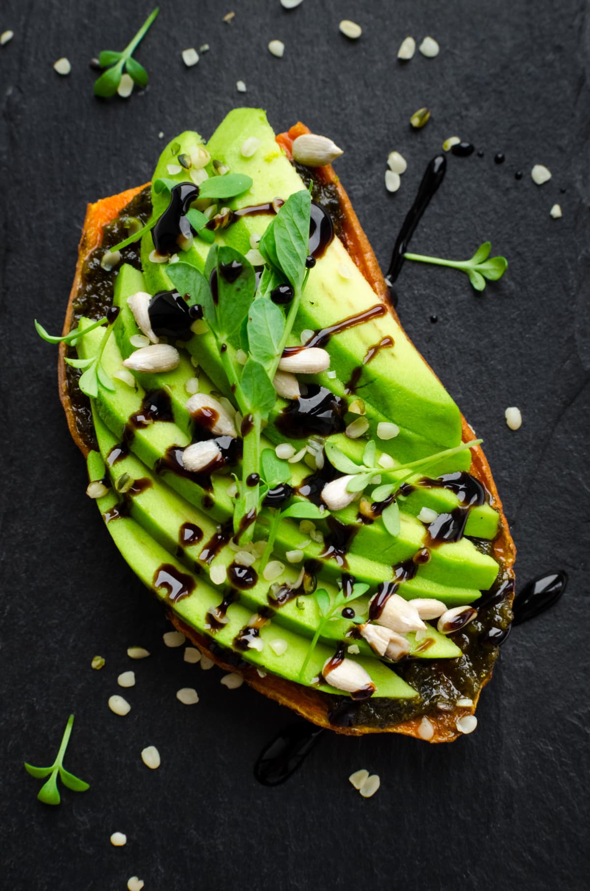 Toast with avocado slices and garnishes