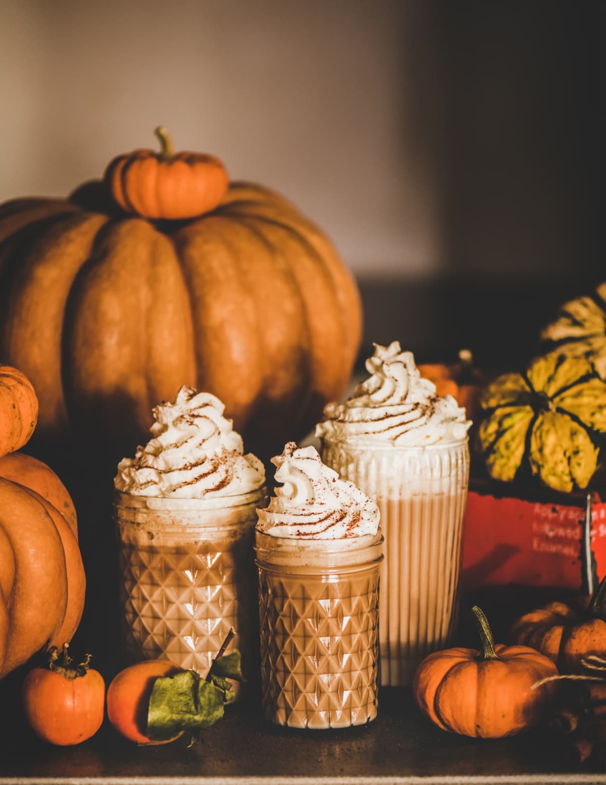 Pumpkin autumn latte warm drink with whipped cream, autumn cozy beverage