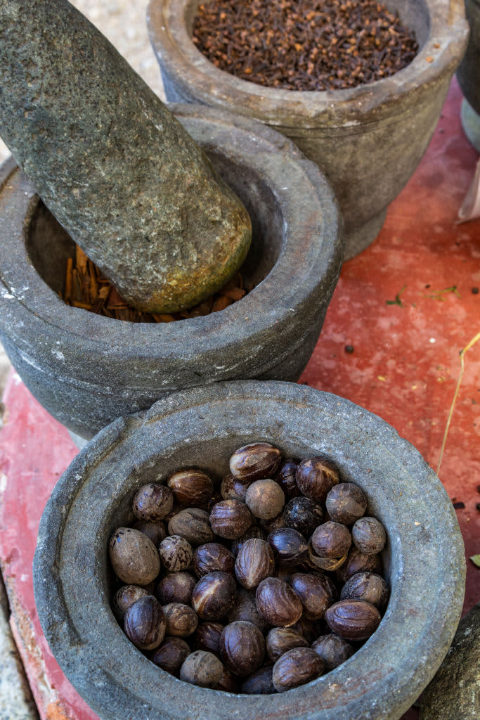 BATU FERINGHI, GEORGE TOWN, PENANG, MALAYSIA - 2019/12/27: Mortar and Pestle at Penang Tropical Spice Garden is an eight-acre jungle with some 500 species of flora and fauna. Southeast Asias only tropical spice garden is a good place to spend the afternoon  the nature conservation complex features three garden trails that take you on 20-45 minute journeys past stream crossings, waterfalls and structures made of recycled organic materials. The award-winning farm was set up utilizing predominantly natural and recycled building materials salvaged from pre-war shop houses or sourced from local antique stores.  The spice garden is located on the northern shore of Penang on an abandoned rubber plantation mear Batu Feriinghi beach.  Calling itself an eco-tourism facility there are three jungle trails; the Spice Trail, Ornamental Trail and Jungle Trail. Each section features special plant collections such as spices and herbs, aquatic plants and jungle flora. You can choose to explore the park on your own as there is instructional signage exhibiting the names and uses of each plant to guide you. (Photo by John S Lander/LightRocket via Getty Images)