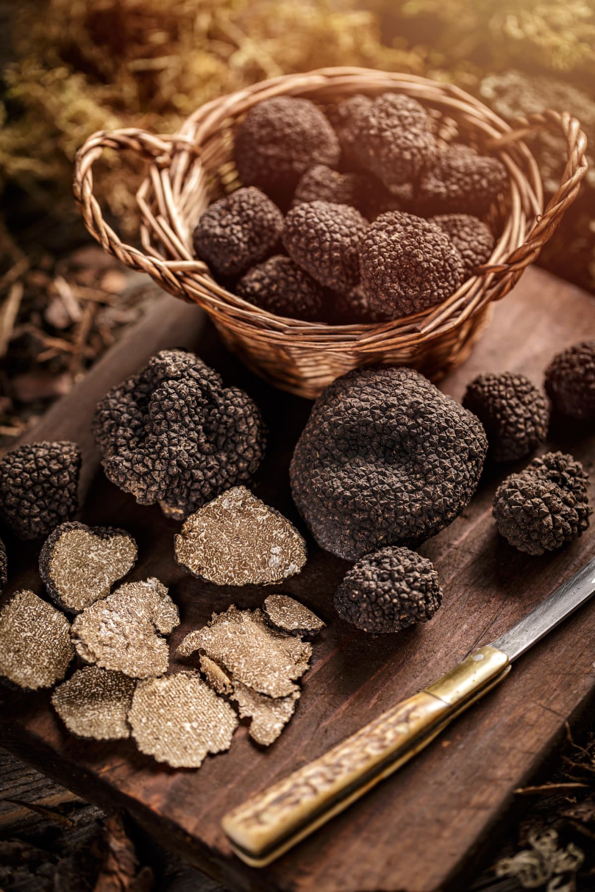 Heap of black truffle mushrooms, whole and slice