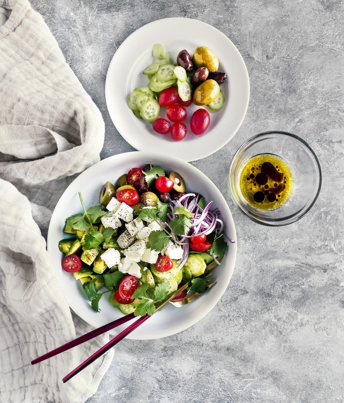 Bowl of fresh salad with feta served on table