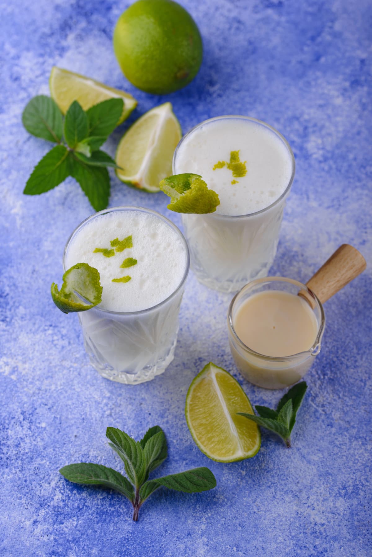 Glasses of fresh Brazilian lemonade or limeade with lime garnish