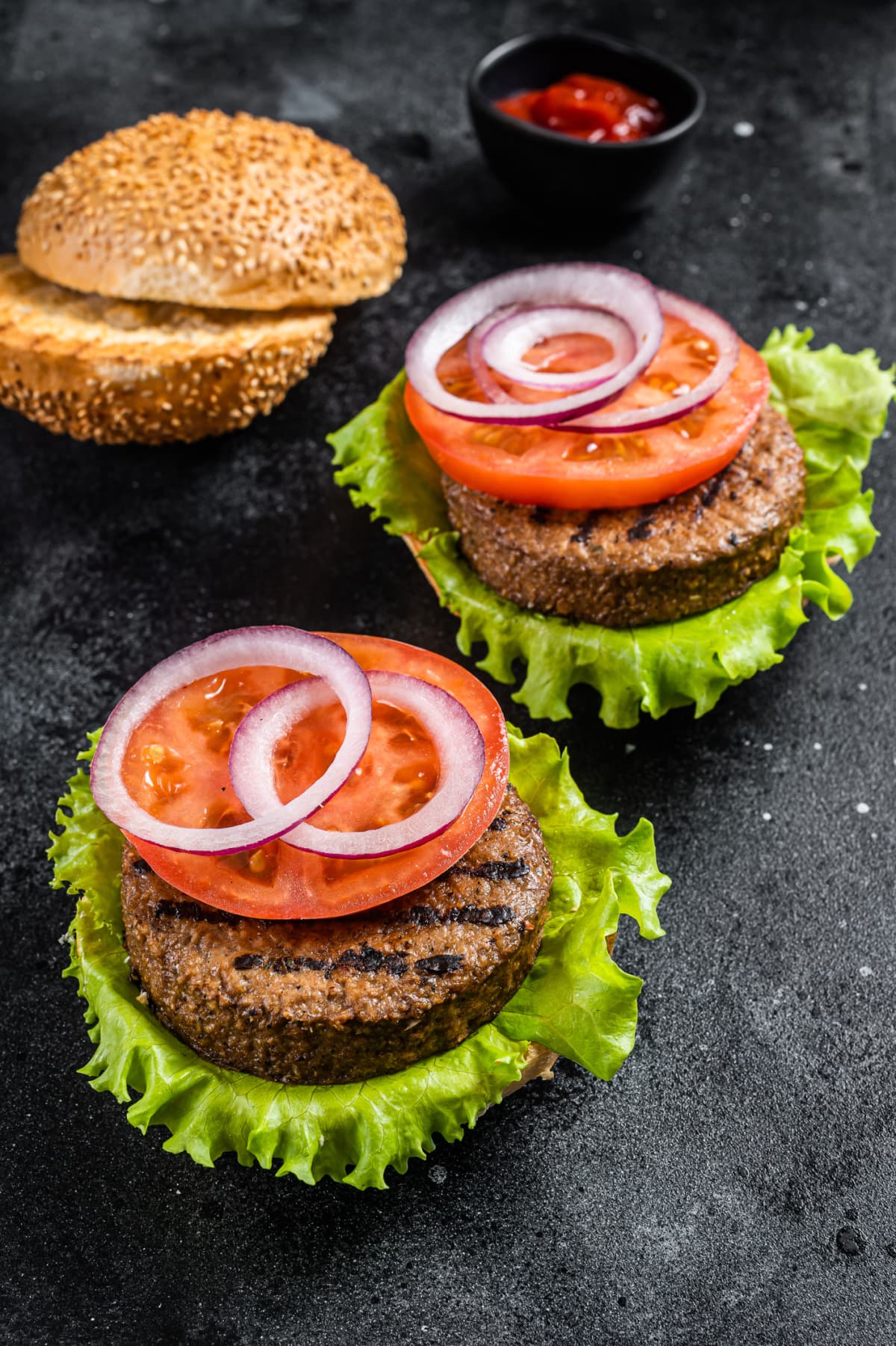 Vegan burgers with onion, tomato, and lettuce