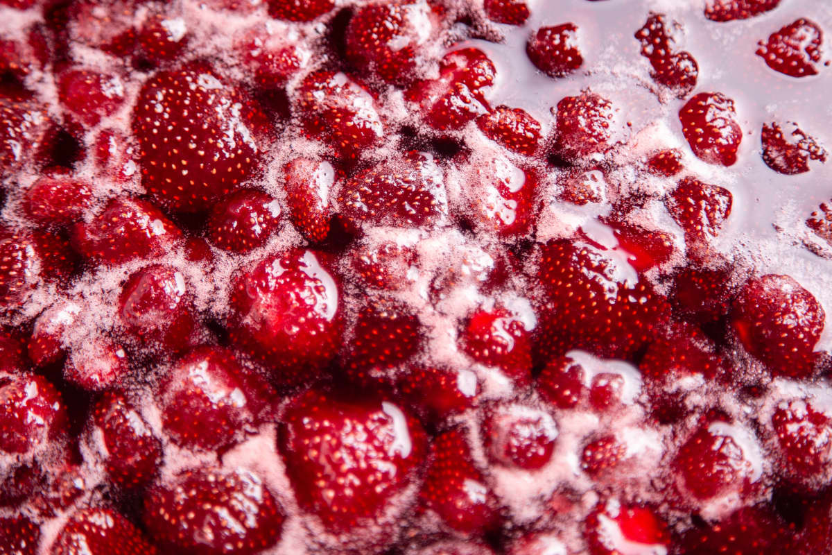 Simmering strawberries for jam