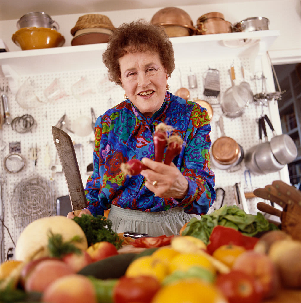(Original Caption) Julia Child poses 3/16 in her Santa Barbara kitchen. Her kitchen is small and square with a single window over the sink.