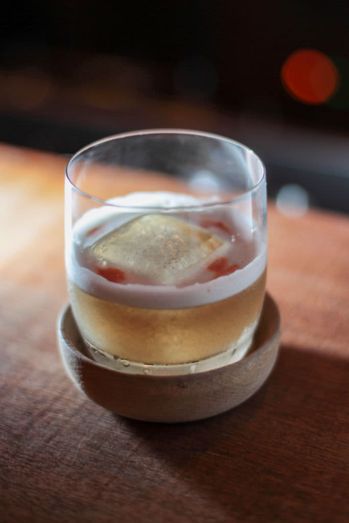 Whiskey sour cocktail with ice