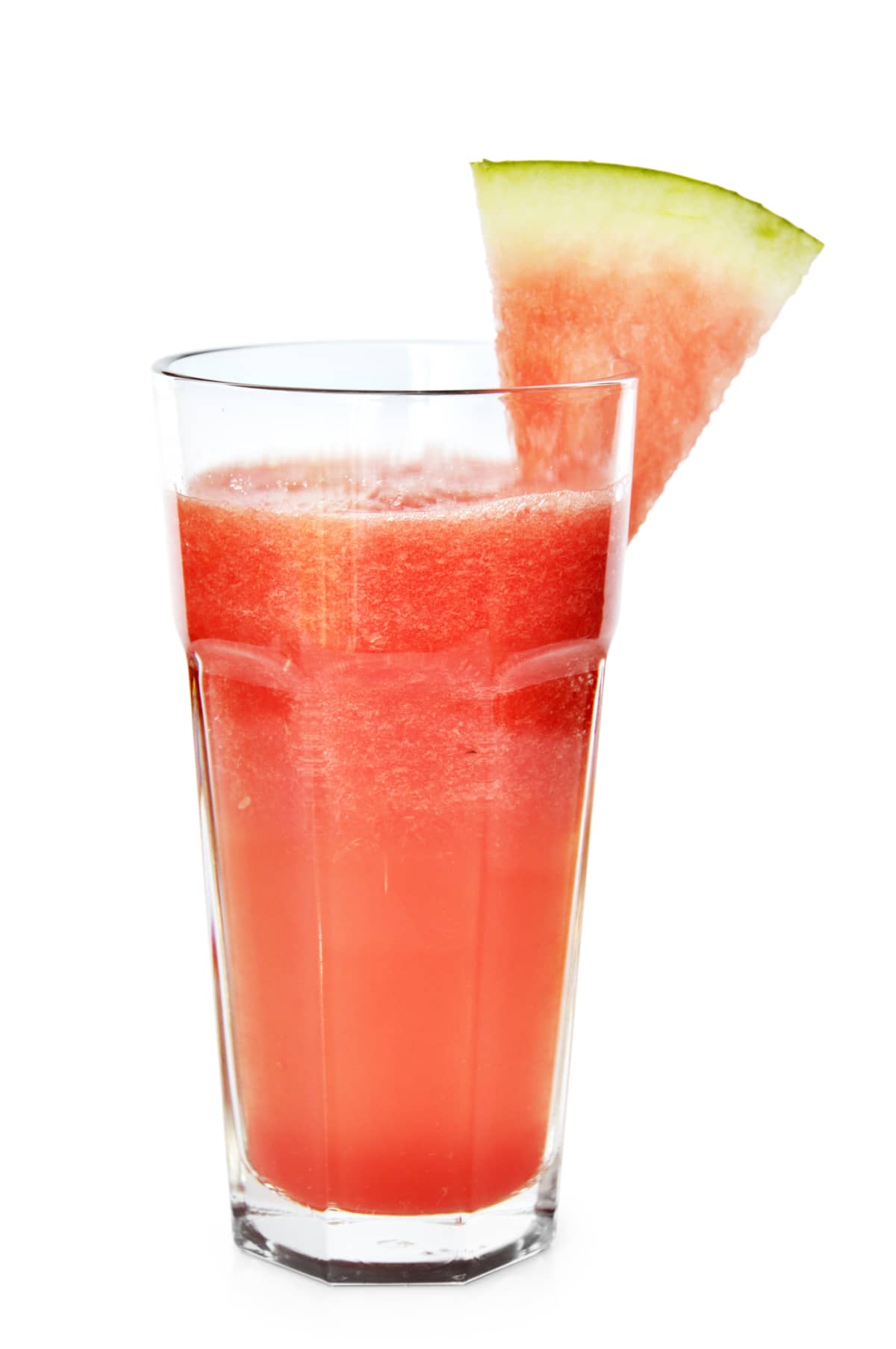 Watermelon smoothie garnished with a watermelon slice isolated on white