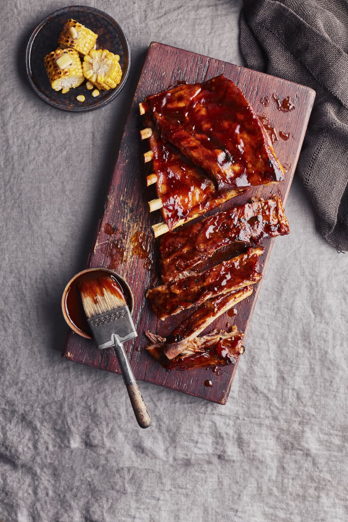 Barbecued pork ribs on wooden cutting board