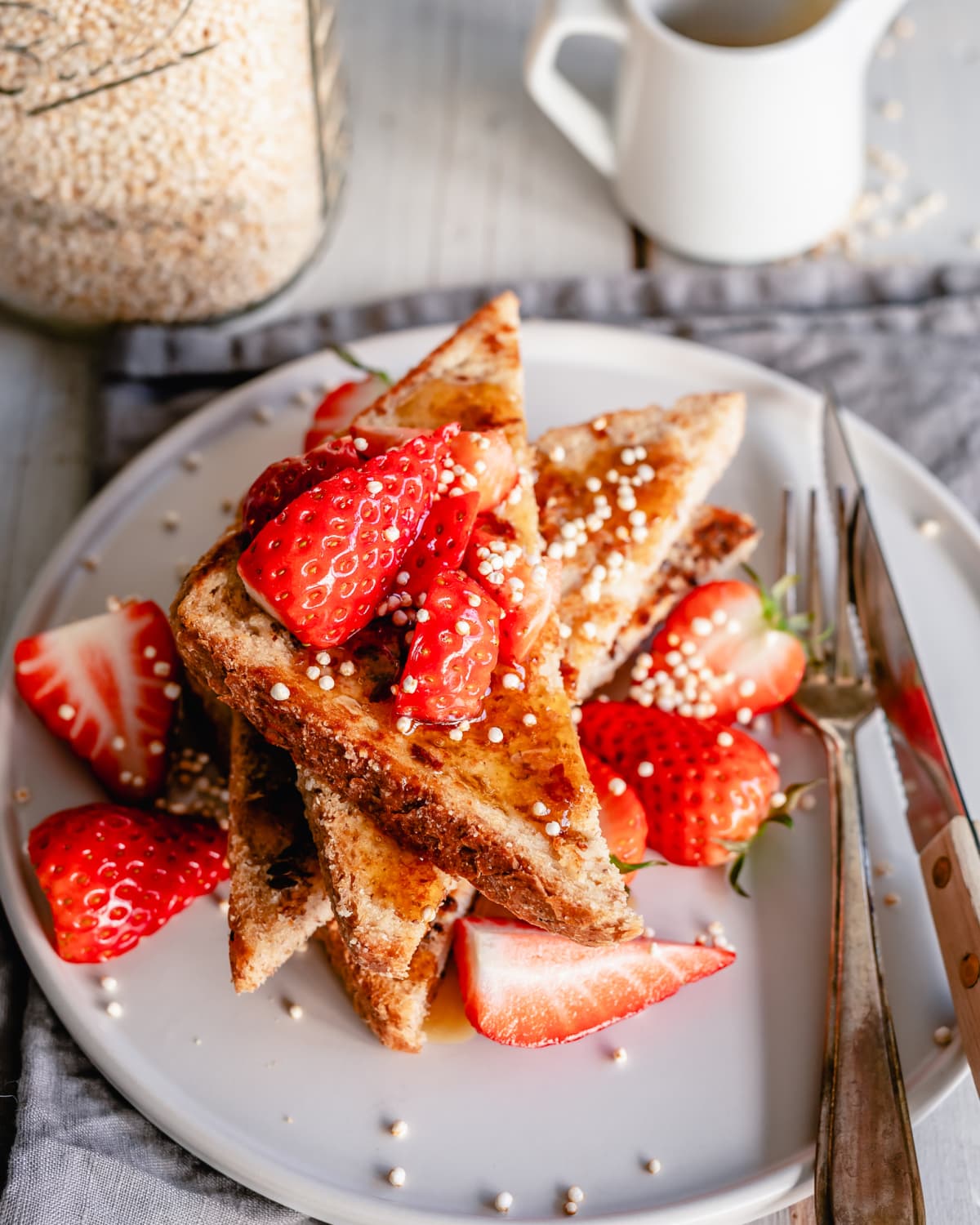 Slices of cinnamon toast, topped with strawberries