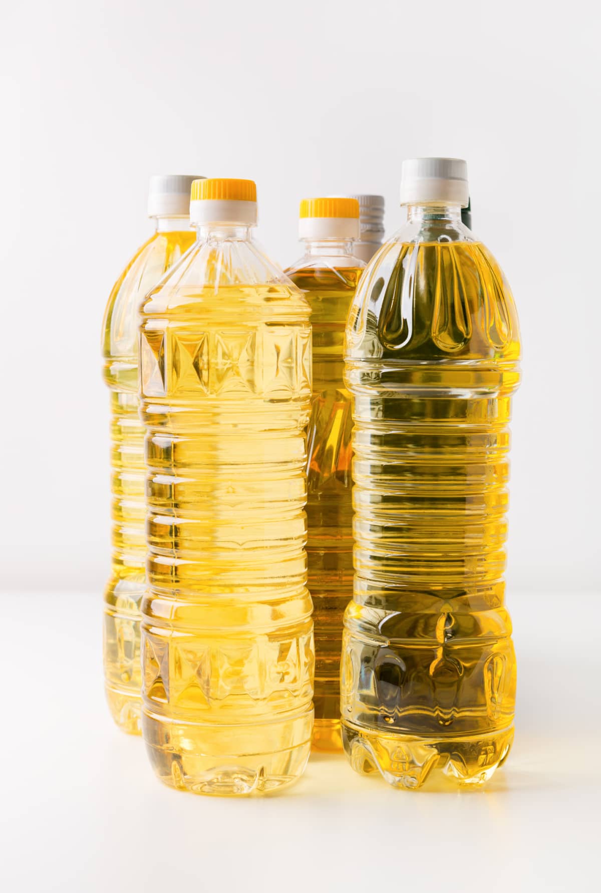 Sunflower oil bottles on white background