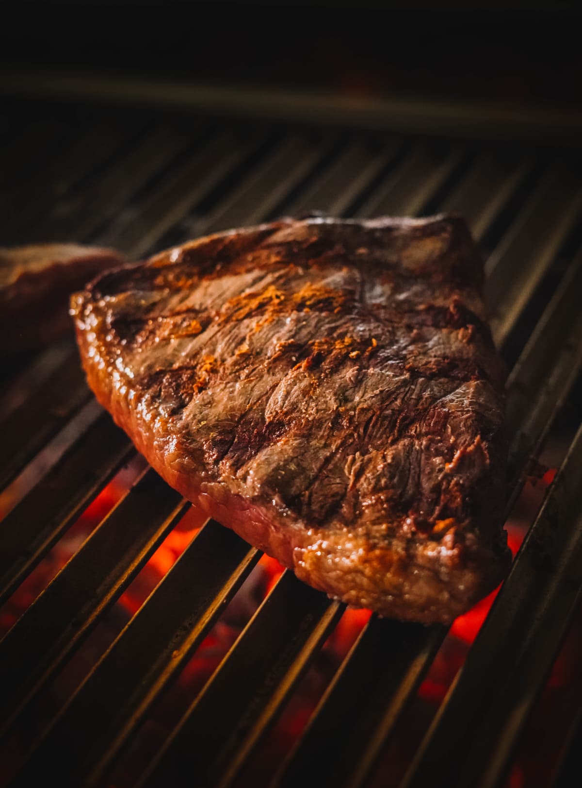 Closeup of steak on grill