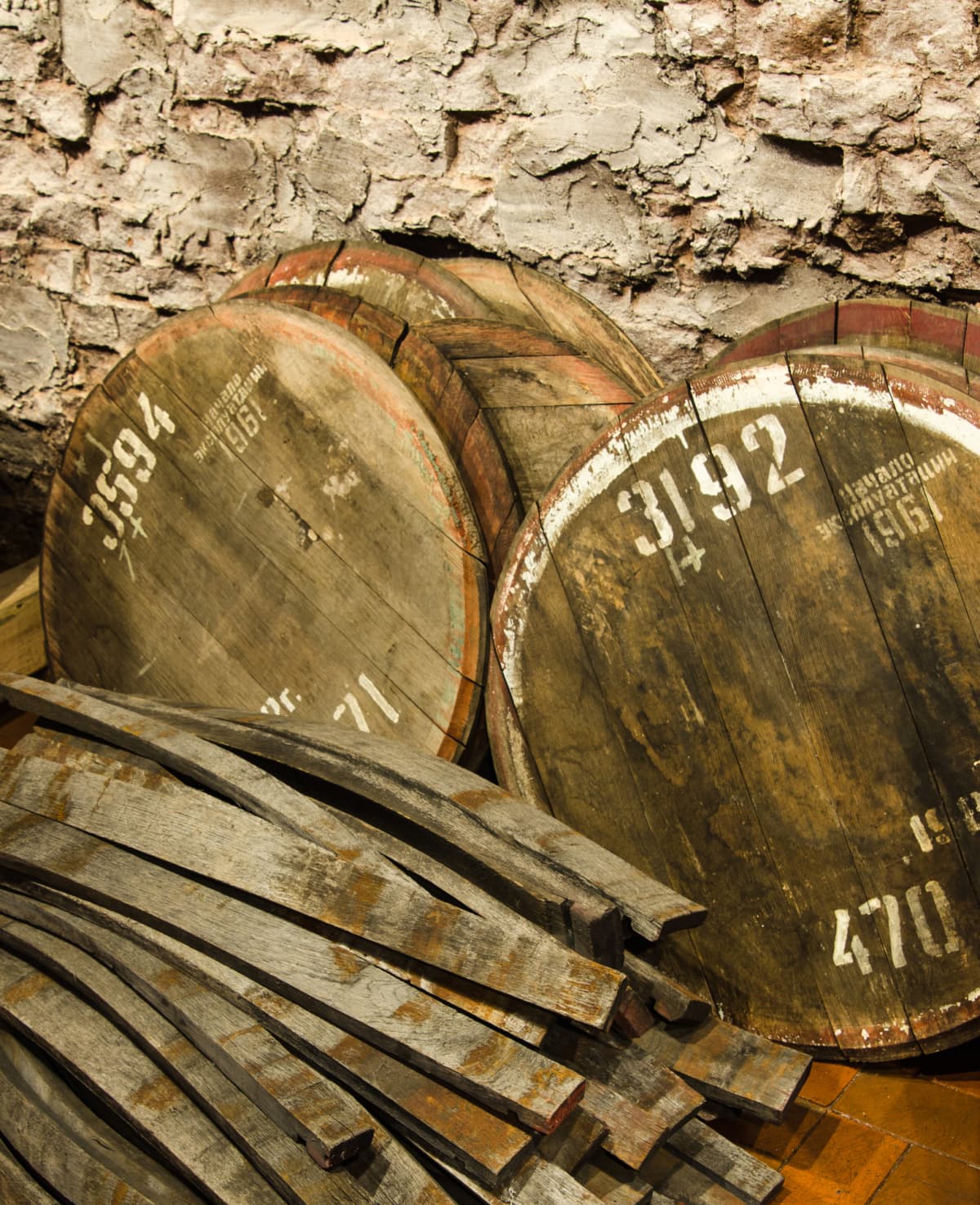 Bourbon barrels next to charred wood