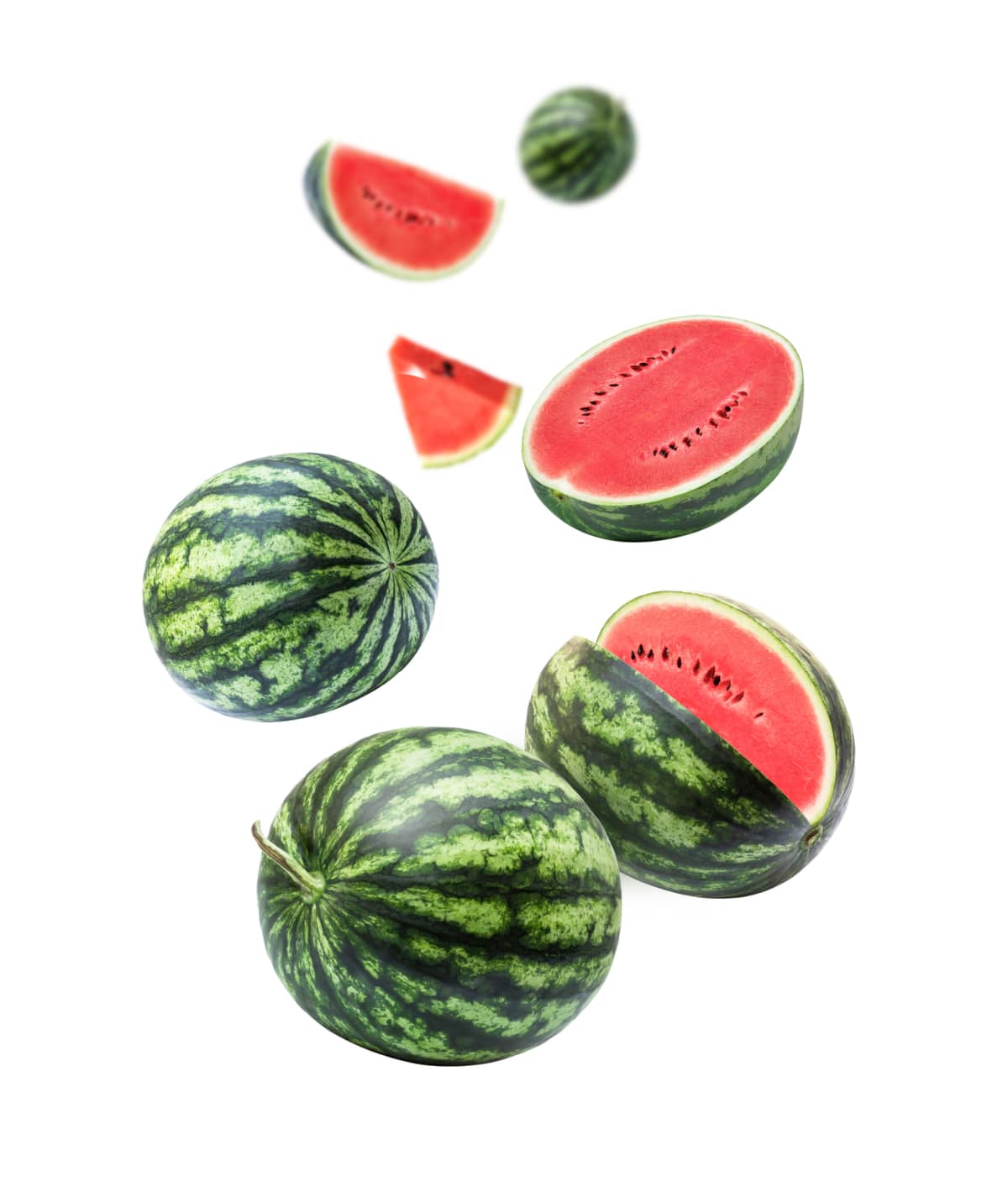 Watermelons falling in the mid air on a white background