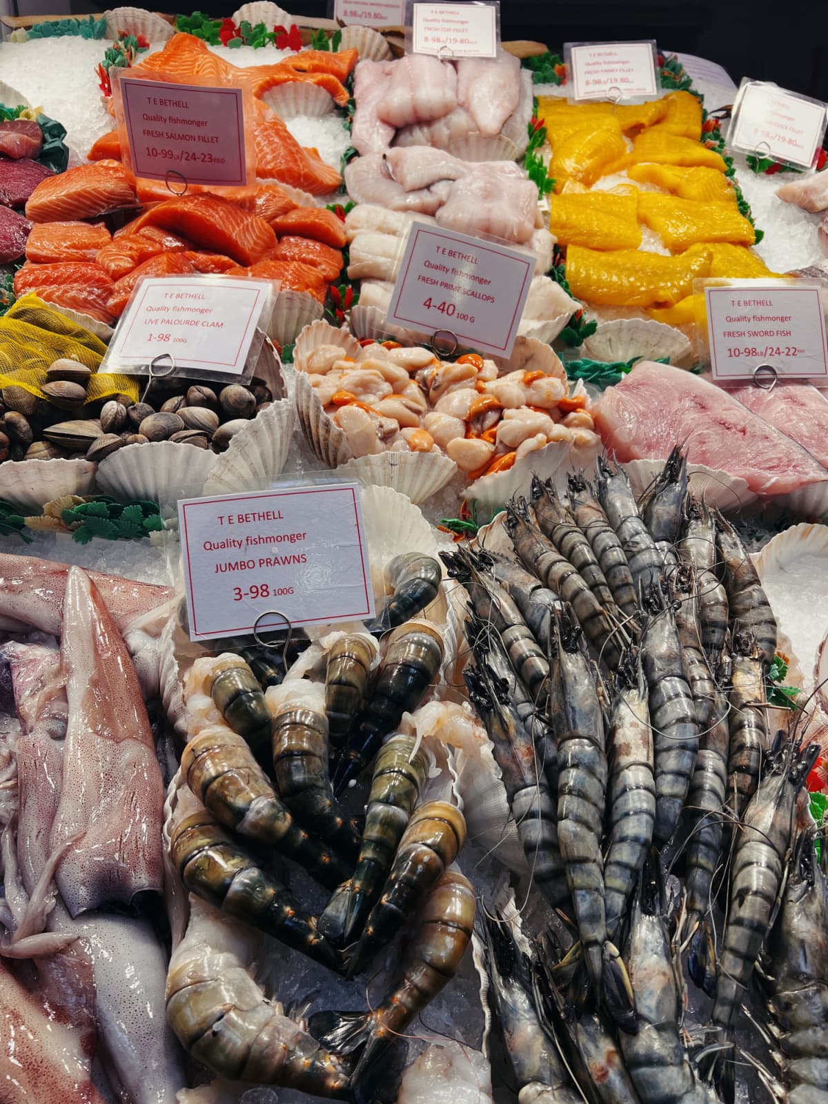 Various seafood on display over ice in market