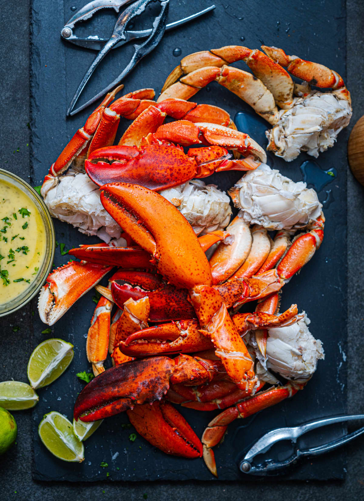 Lobster claws and Dungeness crab legs with lime slices