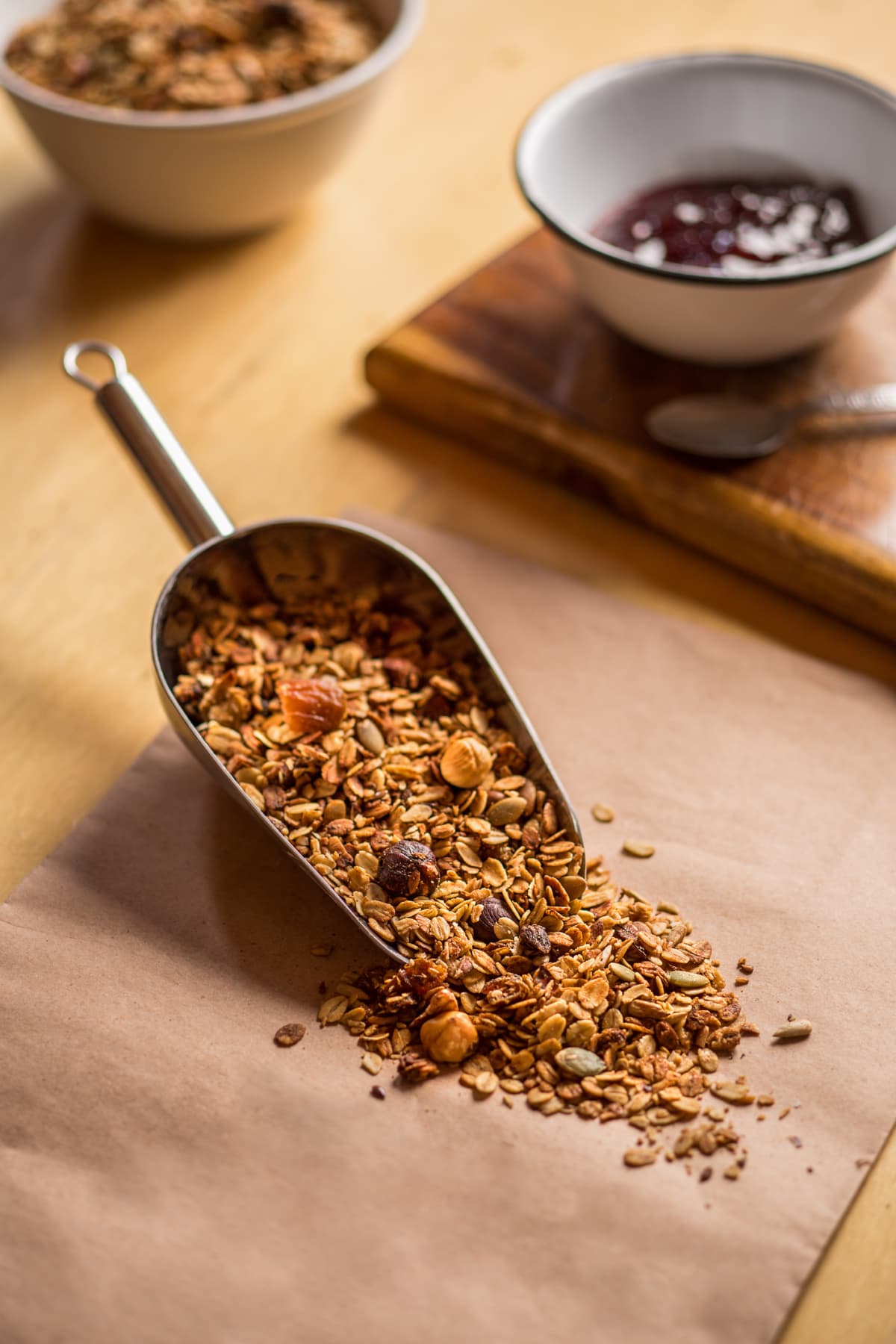 Scoop of healthy and delicious granola made out of oat, nuts, seeds, and dried fruits
