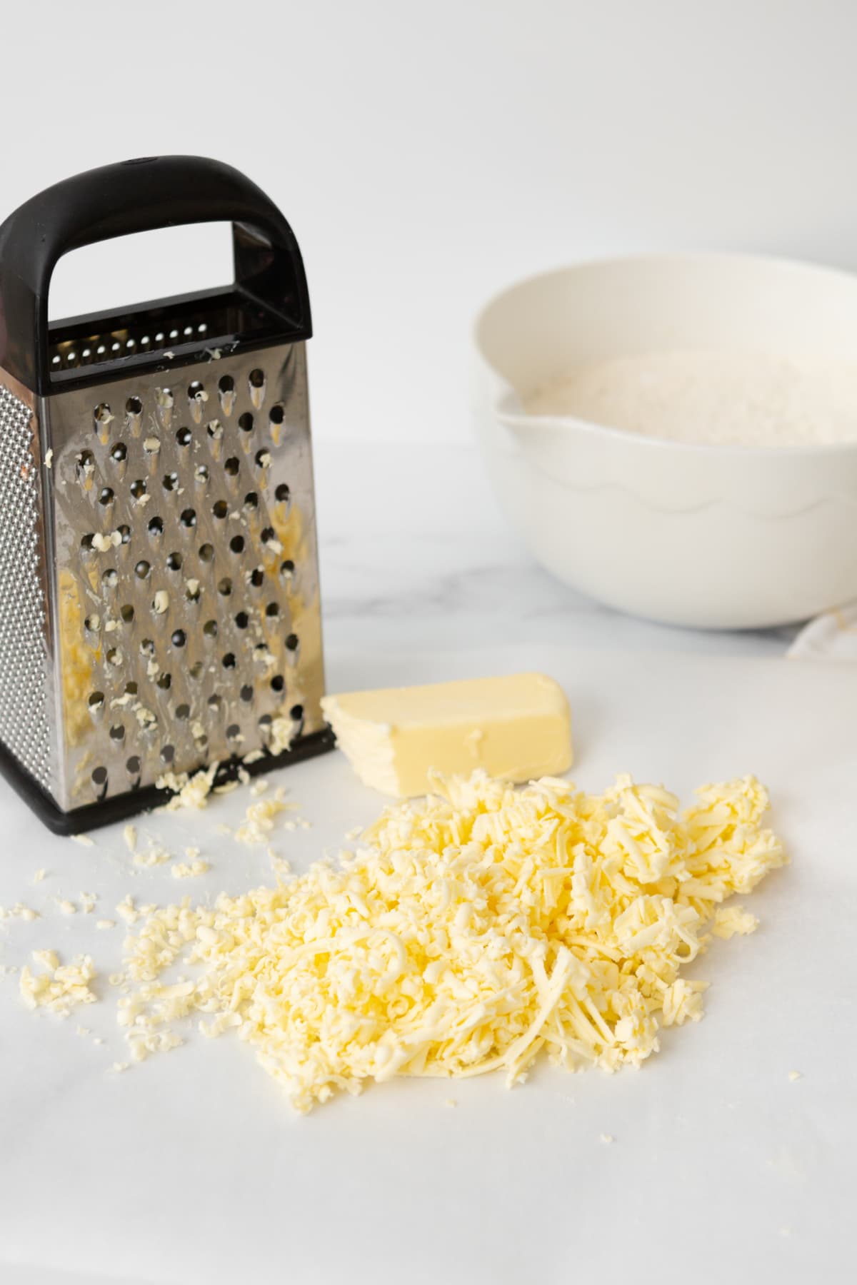 Use a cheese grater on cold butter