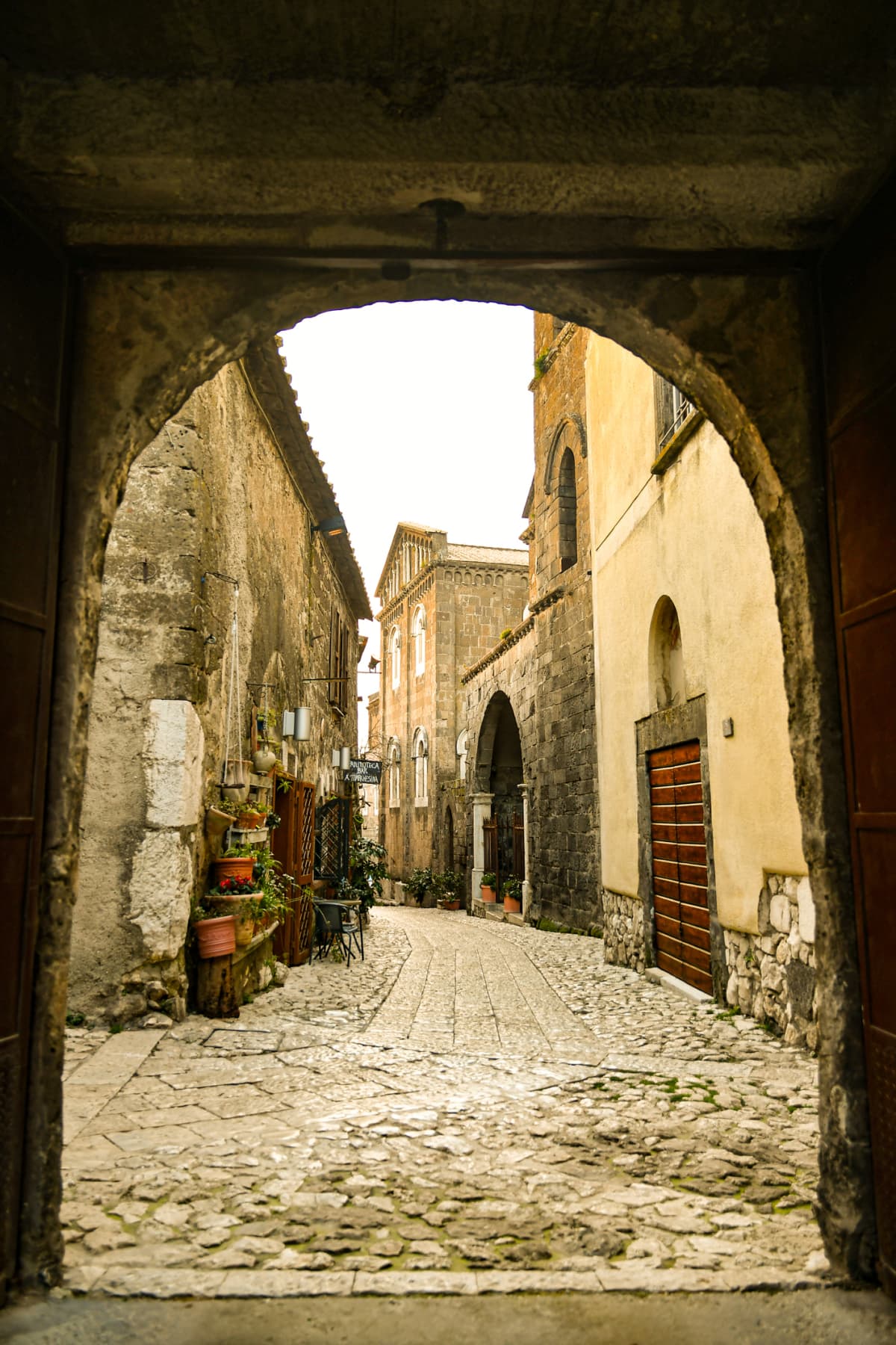 A narrow street among the old houses of a rural town in the province of Caserta.