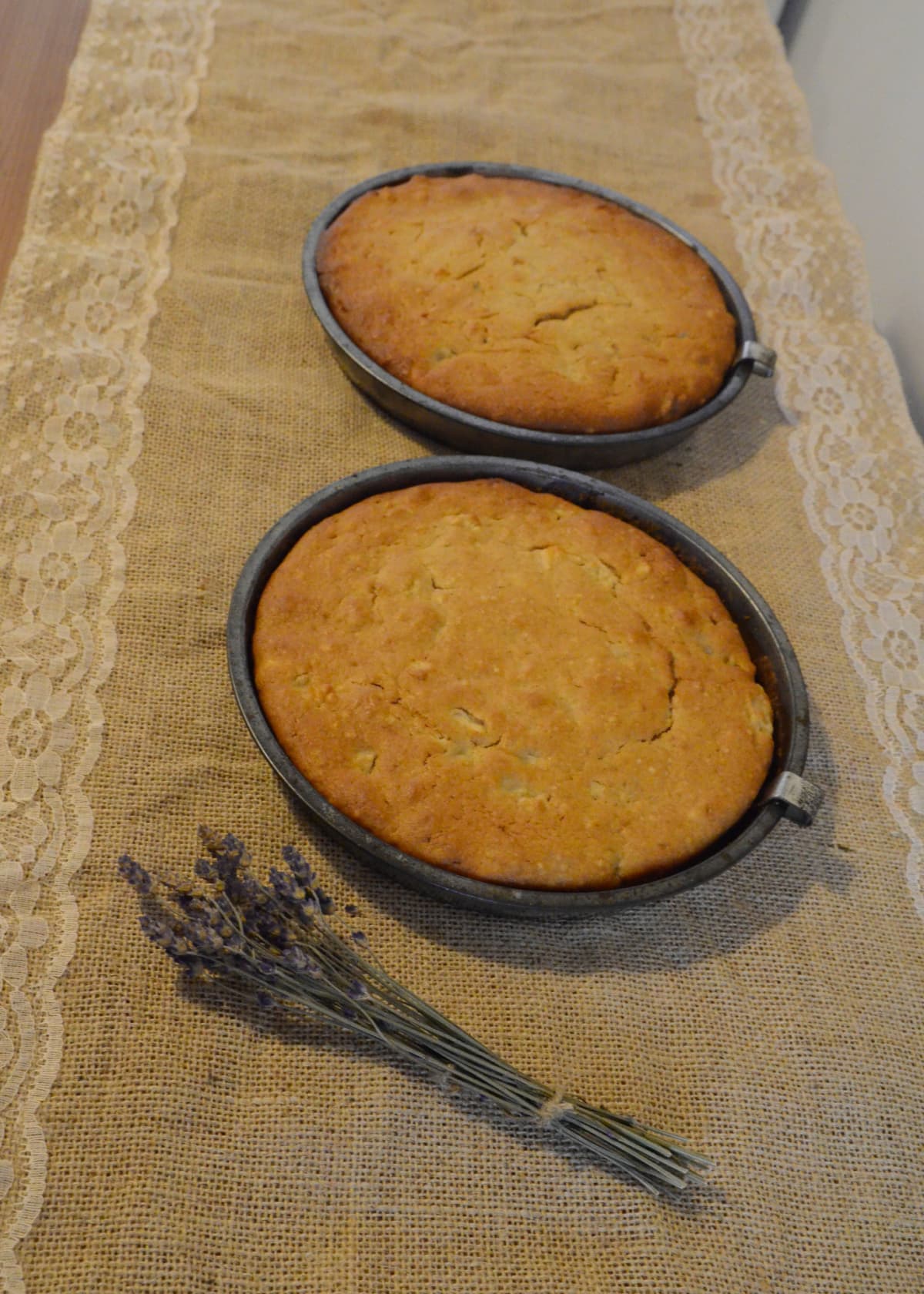 Sponge cakes in tin pans on a table